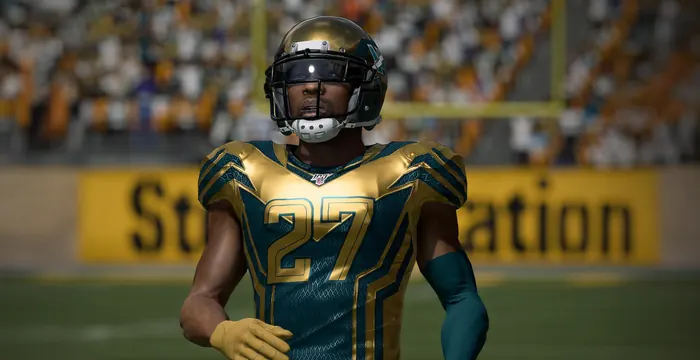 In-game render of an American football player in a gold-trimmed uniform