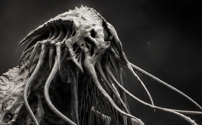 Gray tendrilled creature sculpt in dramatic side light